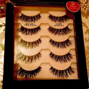 Makeup including false lashes, fake nails, appliers and glue included, etc.